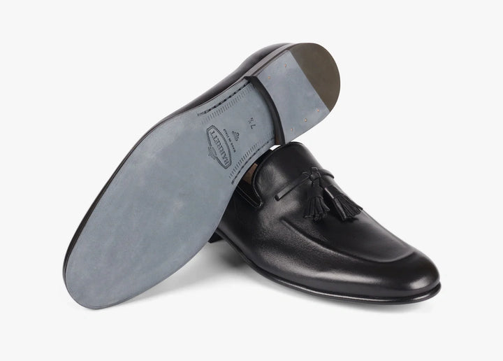 Calfskin loafer with raised piping and tassels