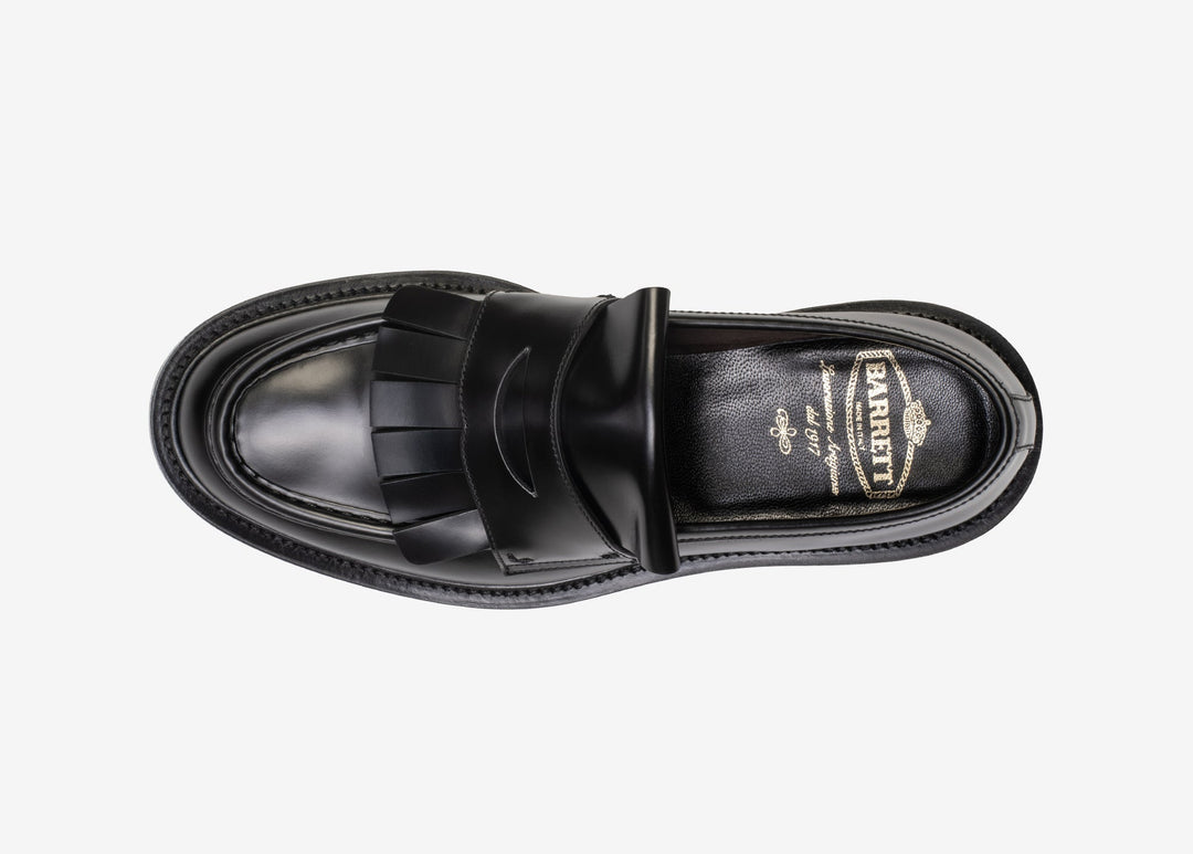 Black loafer with fringe tab