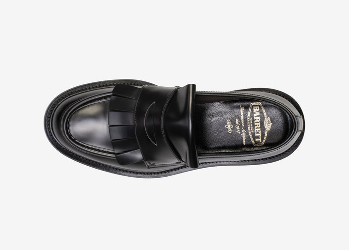 Black loafer with fringe tab