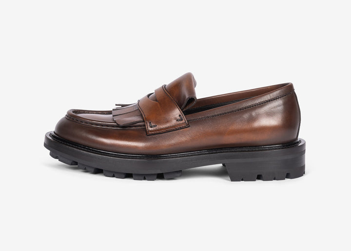 Brown loafer with fringe tab