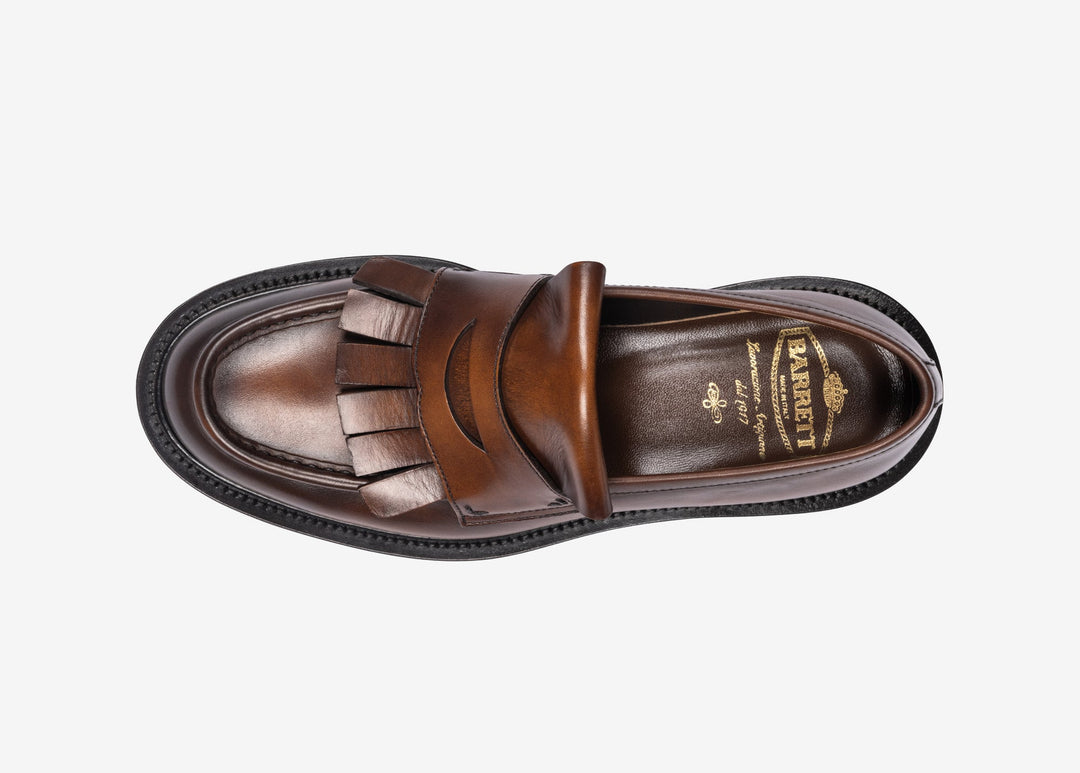 Brown loafer with fringe tab