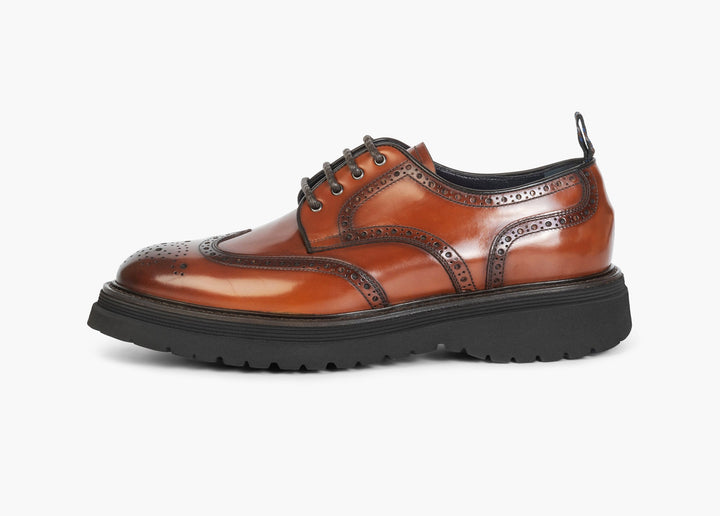 Brown derby with brogue decorations on the upper