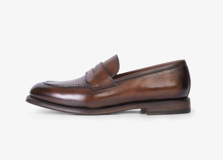 Brown penny loafer in hand-aged leather