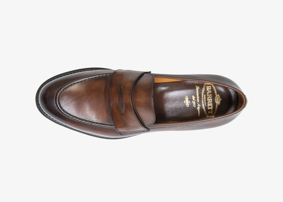 Brown penny loafer in hand-aged leather