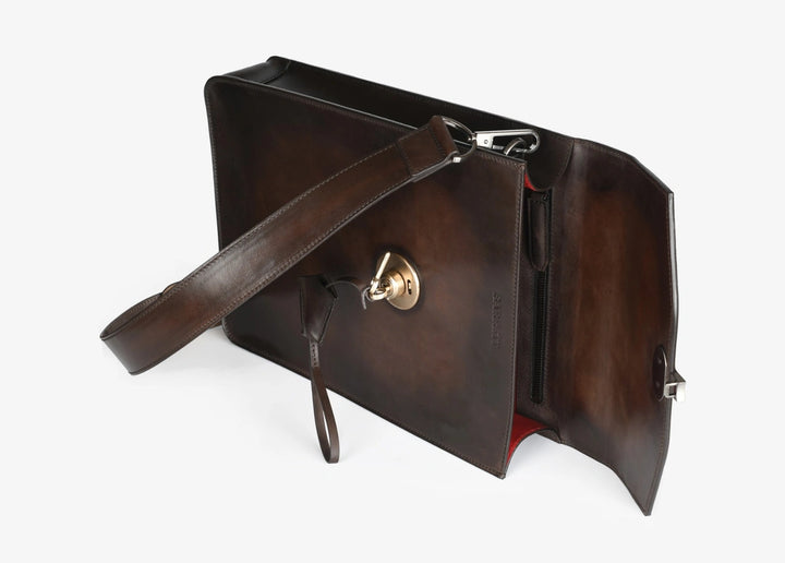 Hand-aged bag with snap fastening